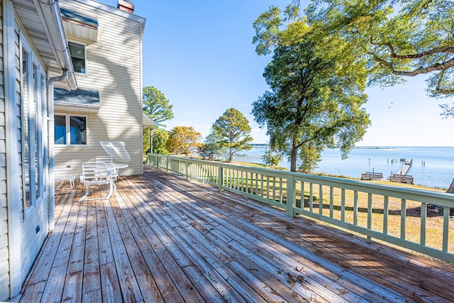 wooden deck featuring a water view