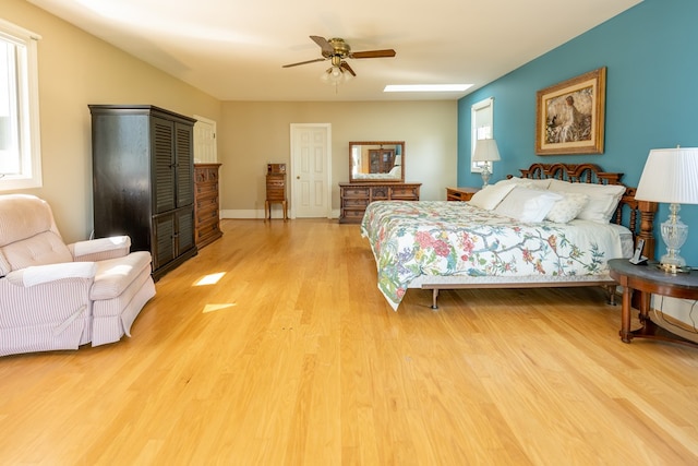 bedroom featuring hardwood / wood-style flooring and ceiling fan