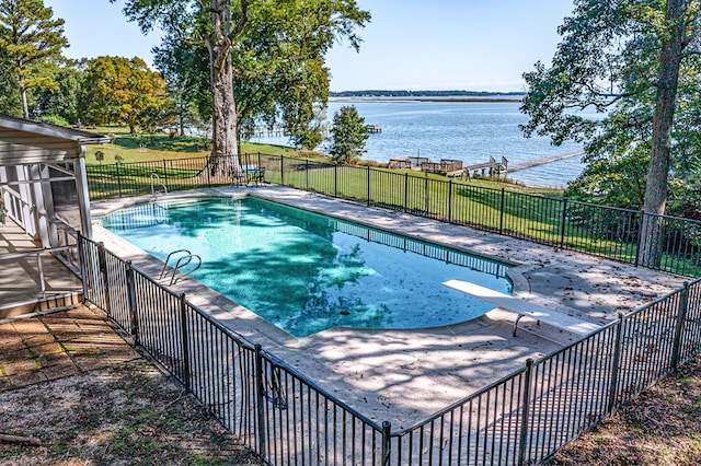 view of pool with a diving board, a water view, and a patio