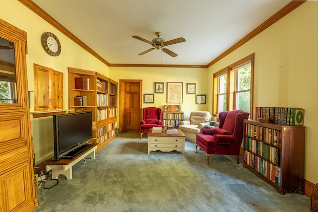 living area featuring dark colored carpet, ceiling fan, and ornamental molding