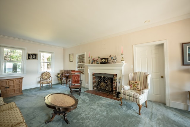 sitting room with crown molding, carpet floors, and a brick fireplace