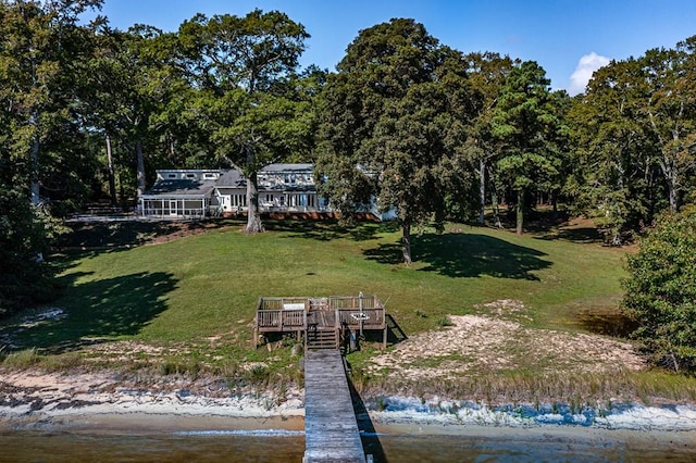 exterior space featuring a yard and a water view