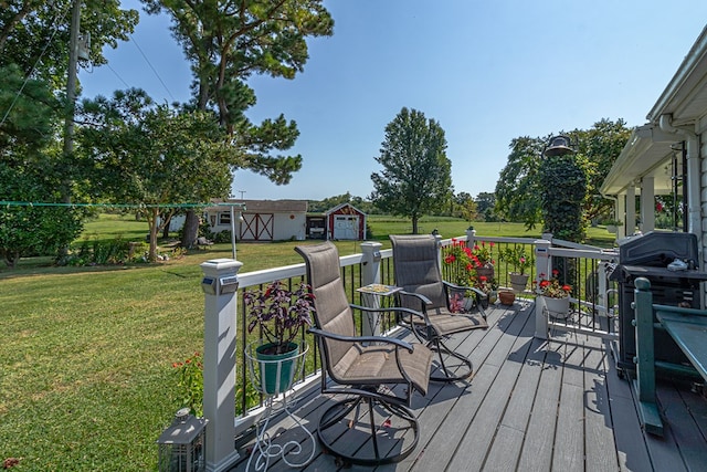 wooden deck with a lawn and a storage shed