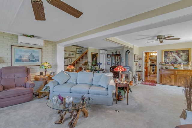 living room with light carpet, a wood stove, an AC wall unit, and ceiling fan