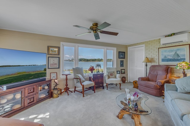 living room featuring ceiling fan, a wall mounted air conditioner, brick wall, light carpet, and a water view