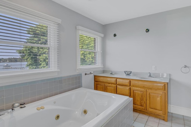 bathroom with vanity, tile patterned floors, and a healthy amount of sunlight