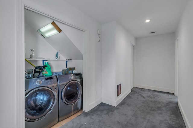 laundry room featuring washer and dryer and carpet flooring