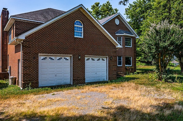 view of property exterior with a garage