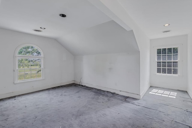 additional living space with vaulted ceiling