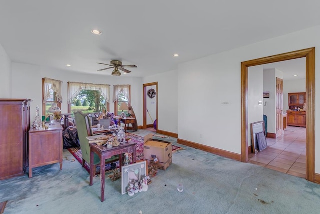 carpeted living room featuring ceiling fan