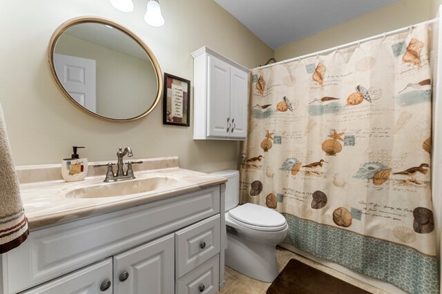 full bathroom featuring curtained shower, toilet, tile patterned flooring, and vanity