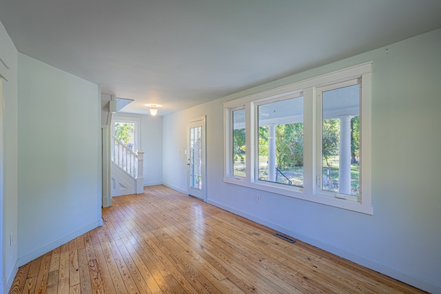 spare room featuring light hardwood / wood-style flooring