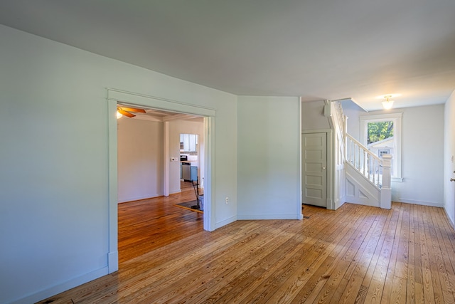 unfurnished room with light hardwood / wood-style floors