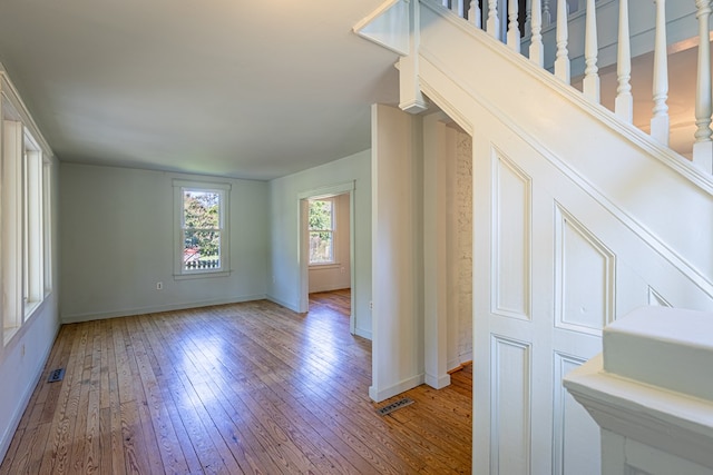 spare room featuring wood-type flooring