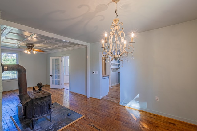 living room featuring hardwood / wood-style flooring, ceiling fan, a wood stove, and coffered ceiling