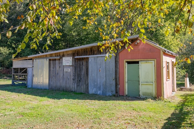 view of outbuilding with a lawn