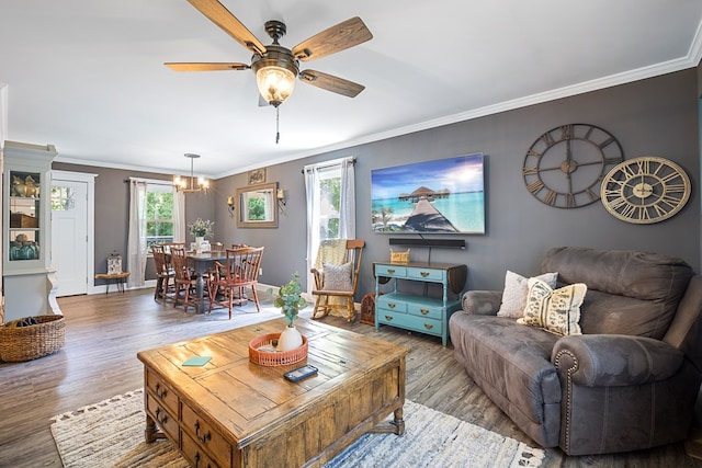 living room featuring ornamental molding and a wealth of natural light