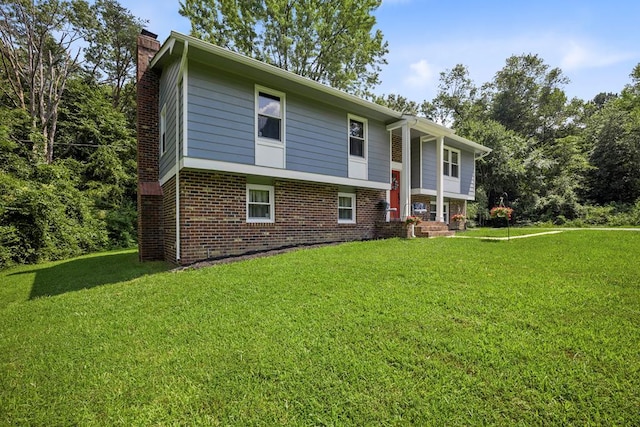 bi-level home with a front yard