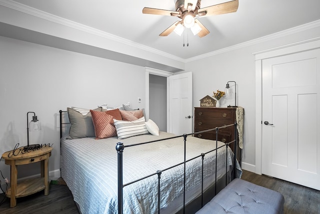 bedroom with ceiling fan, dark hardwood / wood-style floors, and ornamental molding