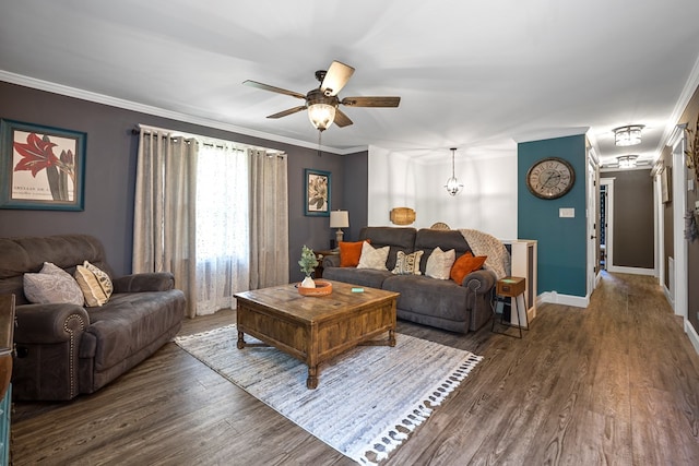 living room with dark wood-type flooring, ceiling fan, and crown molding