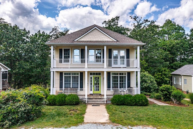 170 Rappa Run Rd, Topping, VA 23169 - view of front of house with a balcony, a porch, a front lawn, and a shingled roof