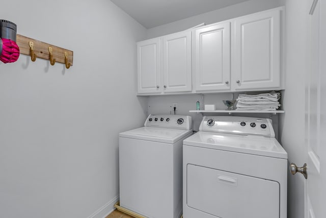 170 Rappa Run Rd, Topping, VA 23169 - laundry area featuring cabinet space, washer and clothes dryer, and baseboards