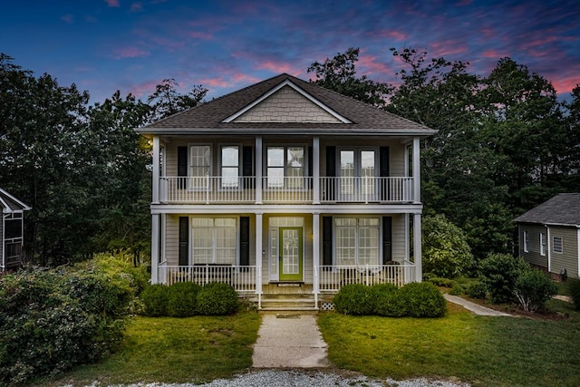 170 Rappa Run Rd, Topping, VA 23169 - view of front of house featuring a balcony, covered porch, a front lawn, and a shingled roof