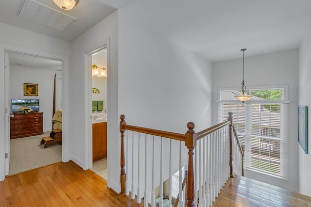 170 Rappa Run Rd, Topping, VA 23169 - corridor with an upstairs landing and light wood finished floors