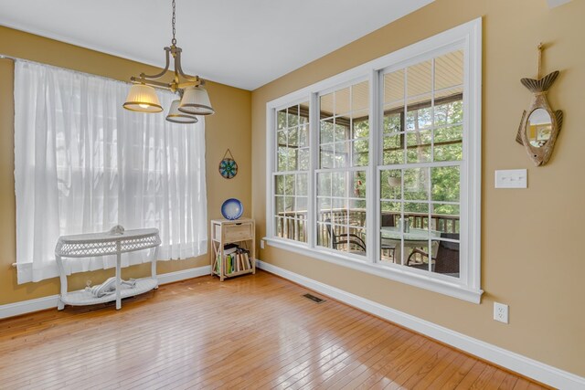 170 Rappa Run Rd, Topping, VA 23169 - dining space featuring a chandelier, baseboards, and hardwood / wood-style flooring