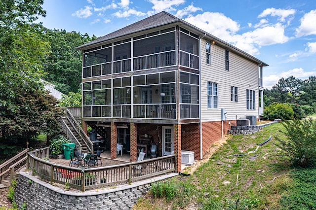 170 Rappa Run Rd, Topping, VA 23169 - rear view of house with a sunroom, stairs, a wooden deck, and a patio