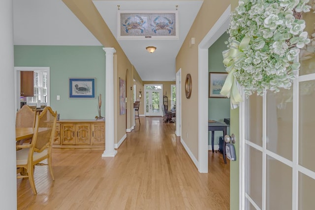 170 Rappa Run Rd, Topping, VA 23169 - foyer with light wood finished floors, decorative columns, and baseboards
