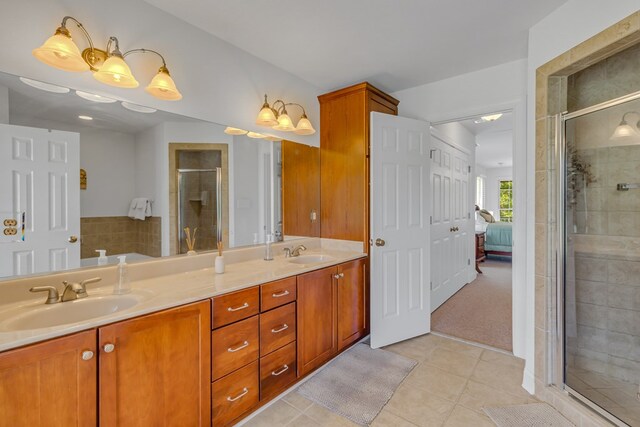 170 Rappa Run Rd, Topping, VA 23169 - full bathroom with tile patterned floors, double vanity, a shower stall, and ensuite bath