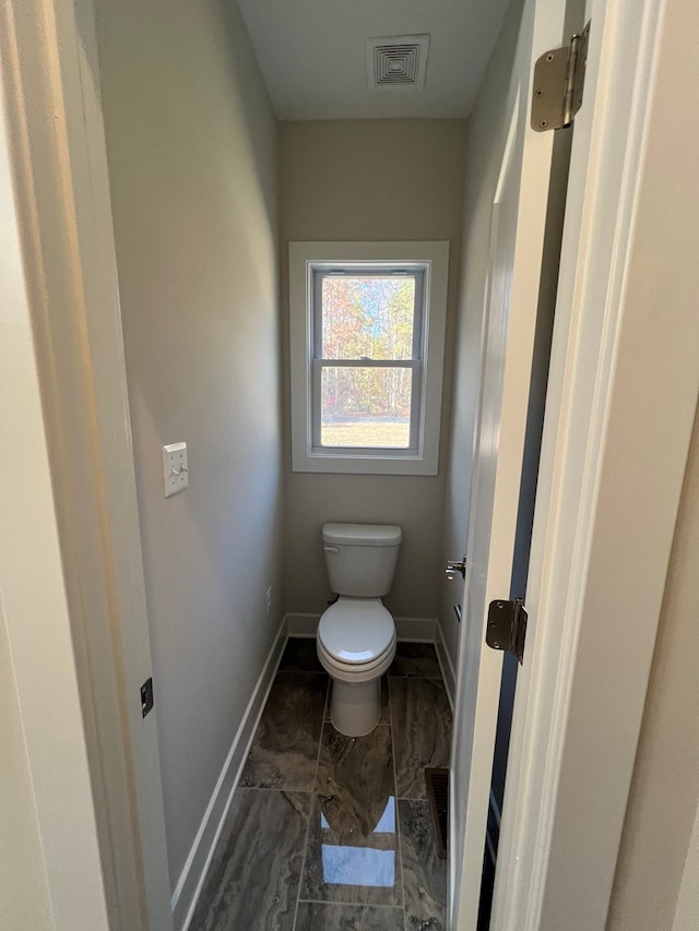 bathroom featuring toilet