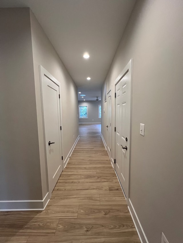 hall with light hardwood / wood-style flooring