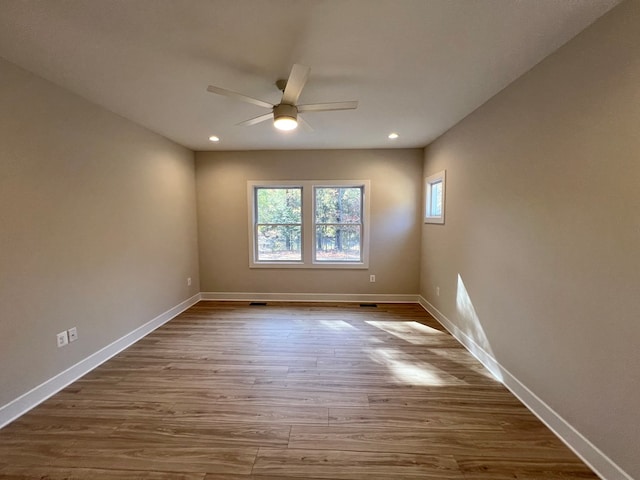 empty room featuring ceiling fan and light wood-type flooring