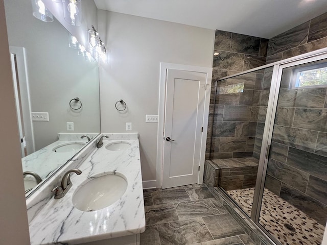 bathroom featuring vanity and a shower with door