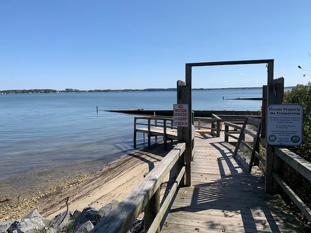 dock area with a water view