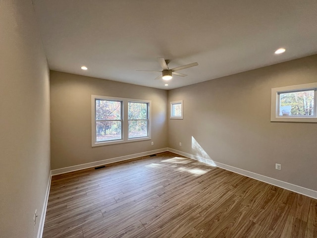 unfurnished room featuring ceiling fan and light wood-type flooring