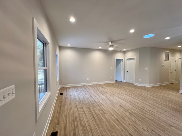 unfurnished room featuring ceiling fan and light hardwood / wood-style floors