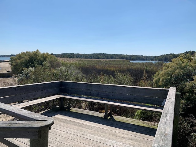 wooden terrace with a water view