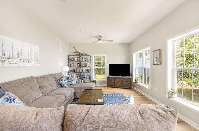 151 Bald Eagle Dr, Montross, VA 22520 - living area featuring healthy amount of natural light, ceiling fan, light wood finished floors, and baseboards
