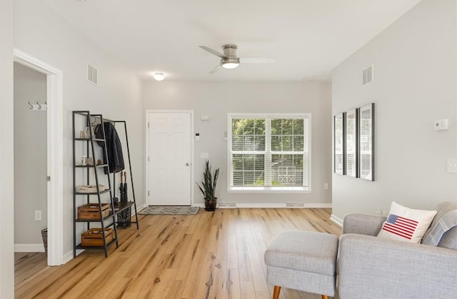 151 Bald Eagle Dr, Montross, VA 22520 - living area with light wood-type flooring, a ceiling fan, and baseboards