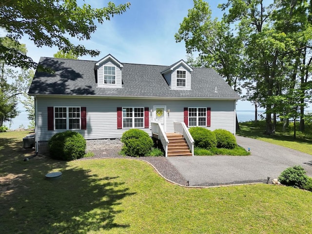 151 Bald Eagle Dr, Montross, VA 22520 - cape cod-style house with a front yard, roof with shingles, and central AC