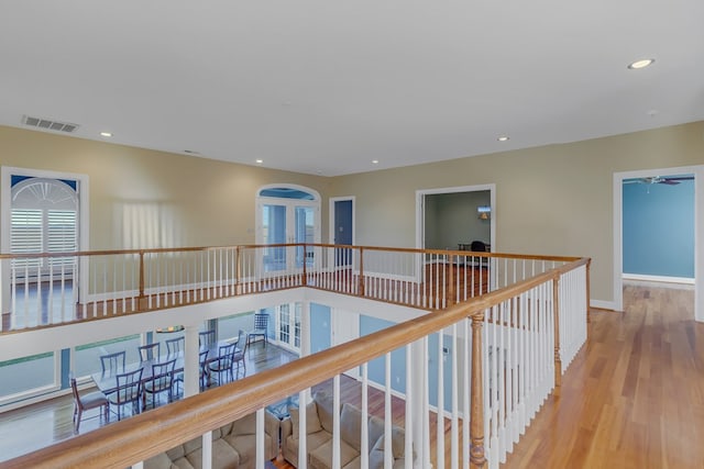 corridor with light hardwood / wood-style floors