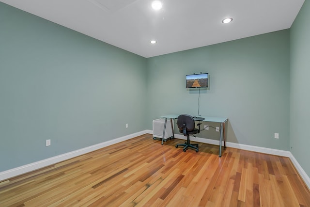 unfurnished office with light wood-type flooring