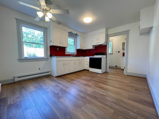 kitchen featuring white electric range, a baseboard radiator, white cabinetry, and sink