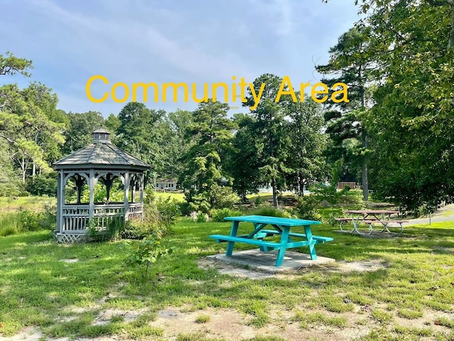 view of home's community with a gazebo and a lawn