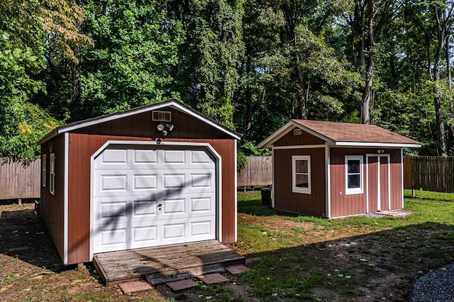 garage featuring a lawn