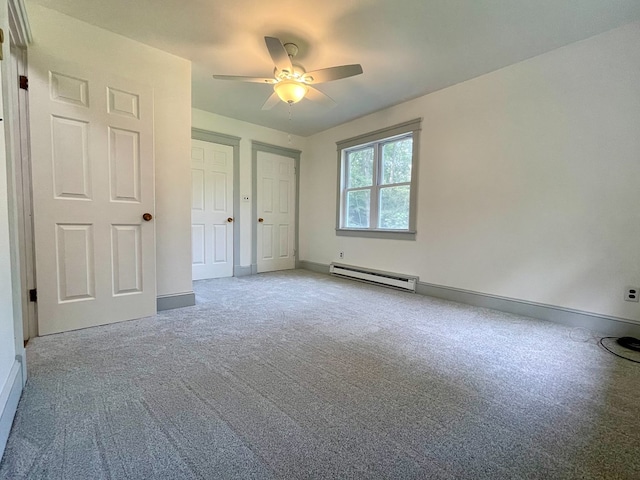 unfurnished bedroom with baseboard heating, ceiling fan, and light colored carpet