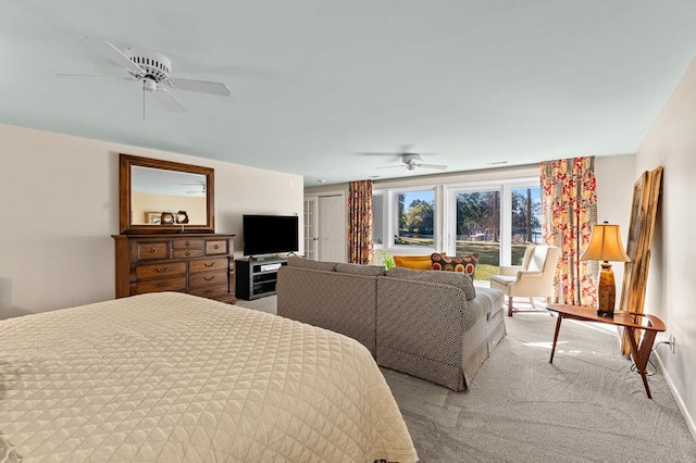 bedroom featuring ceiling fan and light colored carpet